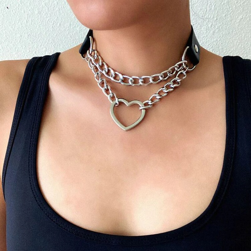 Punk style women's necklace featuring a heart pendant and layered metal chains on a PU leather choker.