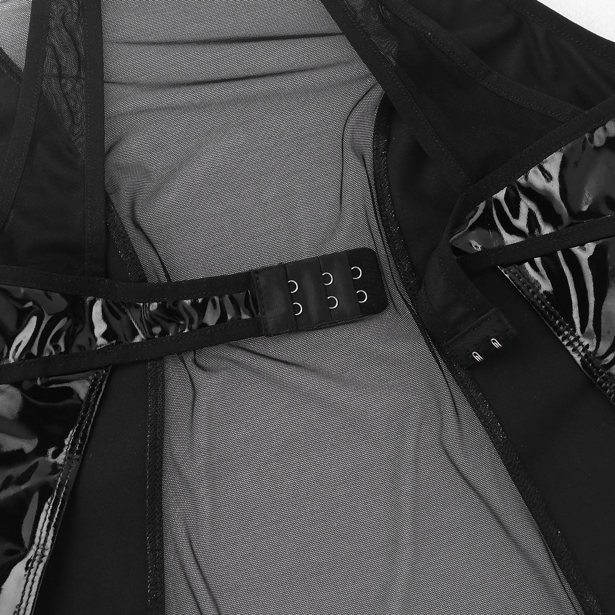 Close-up of the inner detailing of the women's one-piece wet look faux leather lingerie bodysuit.