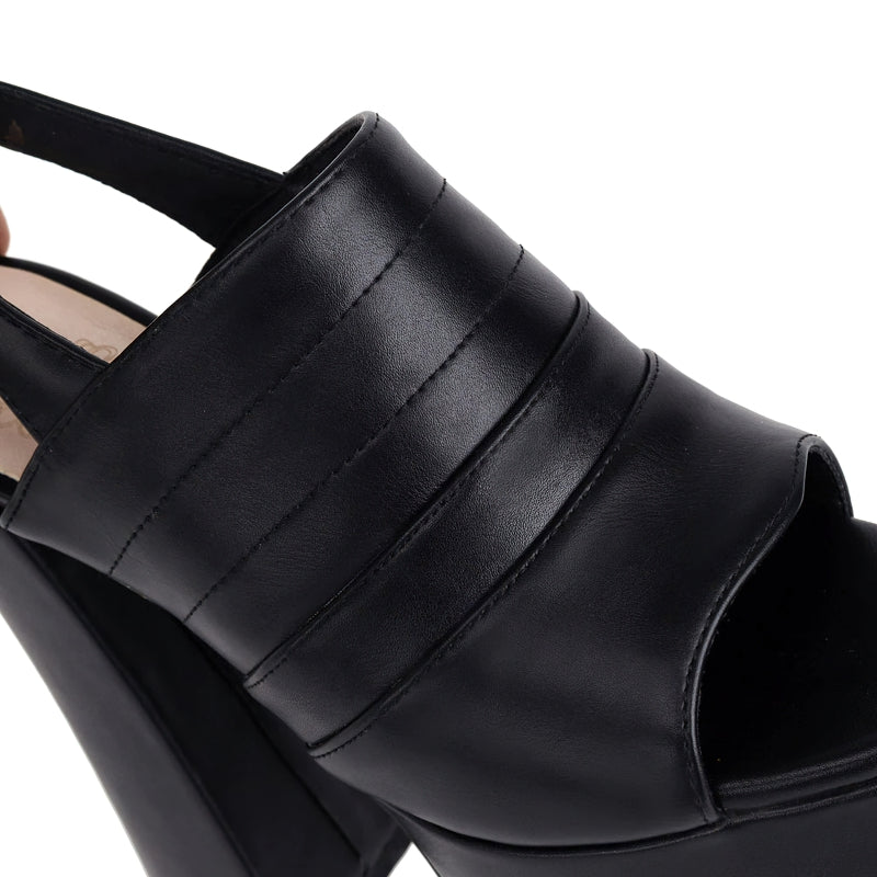 Close-up of stylish black women's open toe platform shoes with a high square heel, perfect for trendy outfits and comfort.