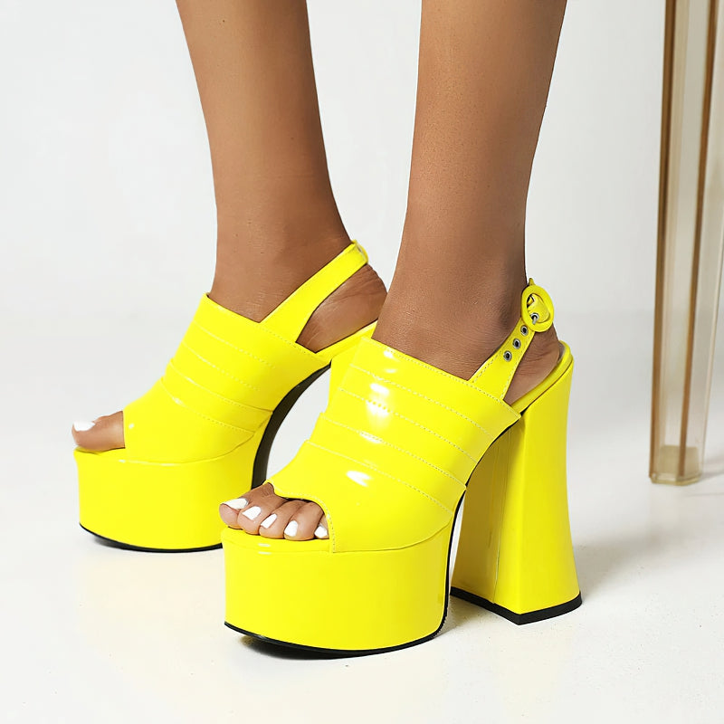 Bright yellow open toe platform sandals with high square heels for trendy summer fashion.