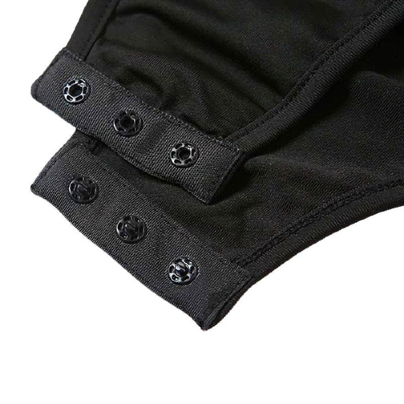 Close-up of black lace dress neckline with snap buttons, showcasing elegant gothic fashion details.