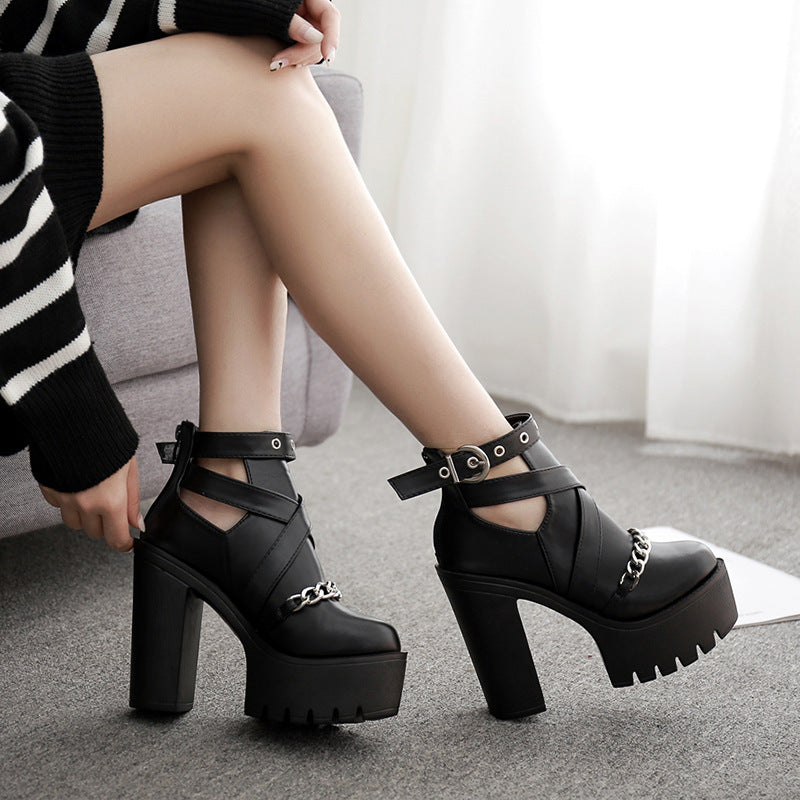 Women's Gothic platform ankle boots with chain and thick heel, showcasing unique style and comfort.