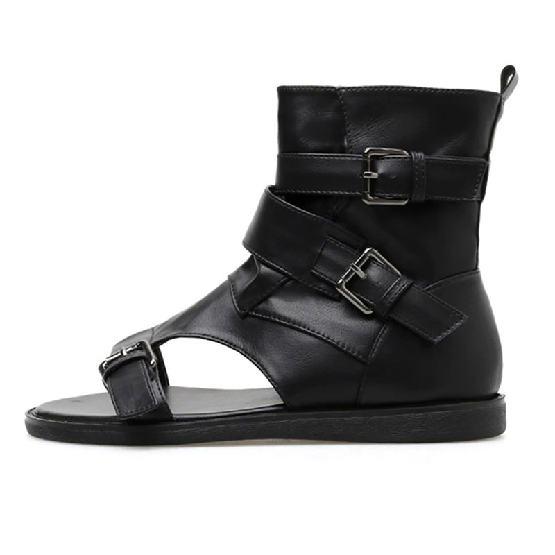 Women's black PU leather gladiator sandals with buckles in alternative fashion style.
