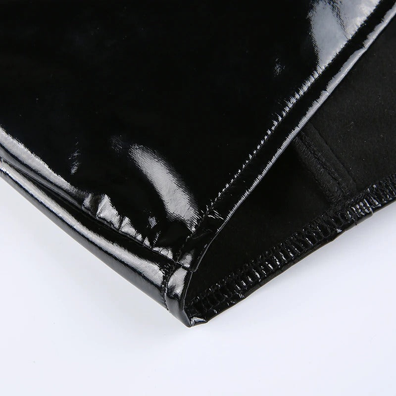 Close-up of glossy black PU leather fabric showcasing the unique texture of a women's gothic tank top.