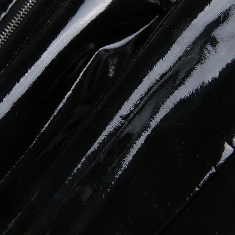 Close-up of shiny black PU leather texture showcasing glossy finish and sleek design details.