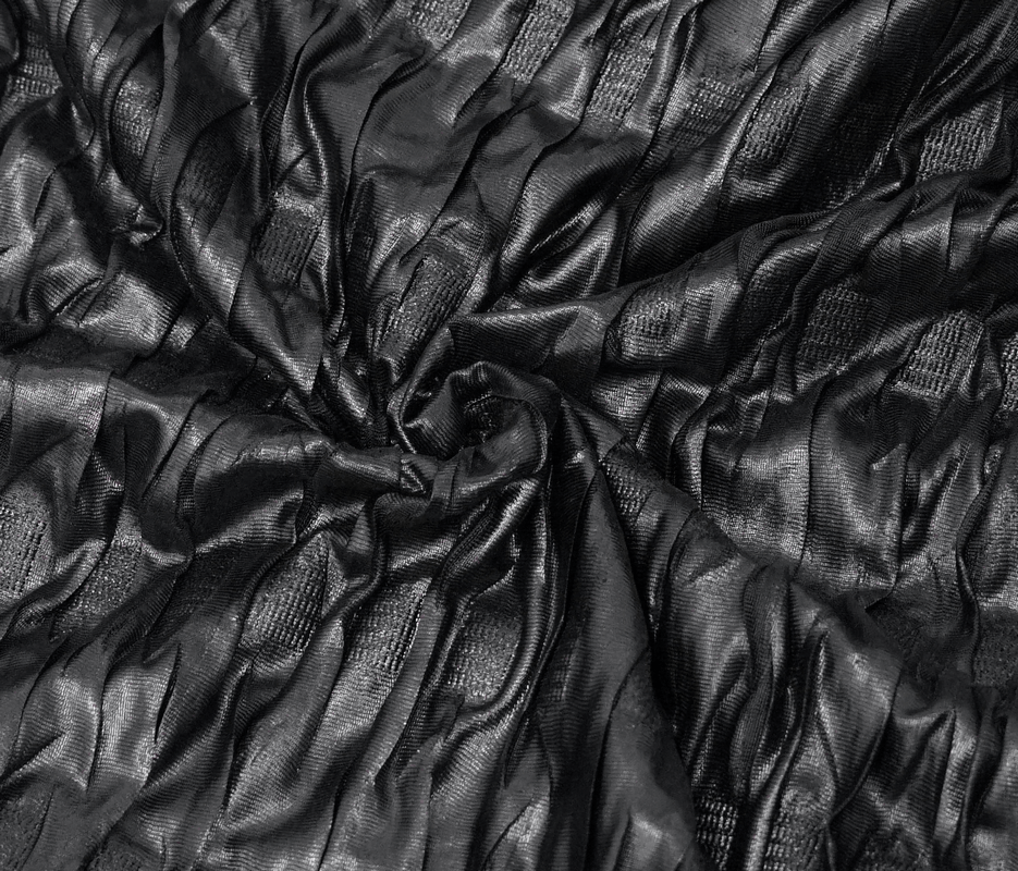 Textured black fabric showcasing intricate waves, perfect for gothic clothing and stylish outfits.