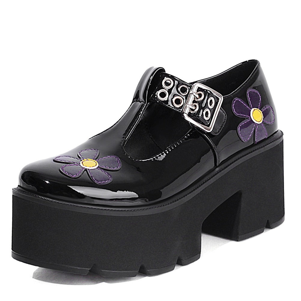 Black punk style platform pumps with colorful flower design and square heel for trendy outfits.