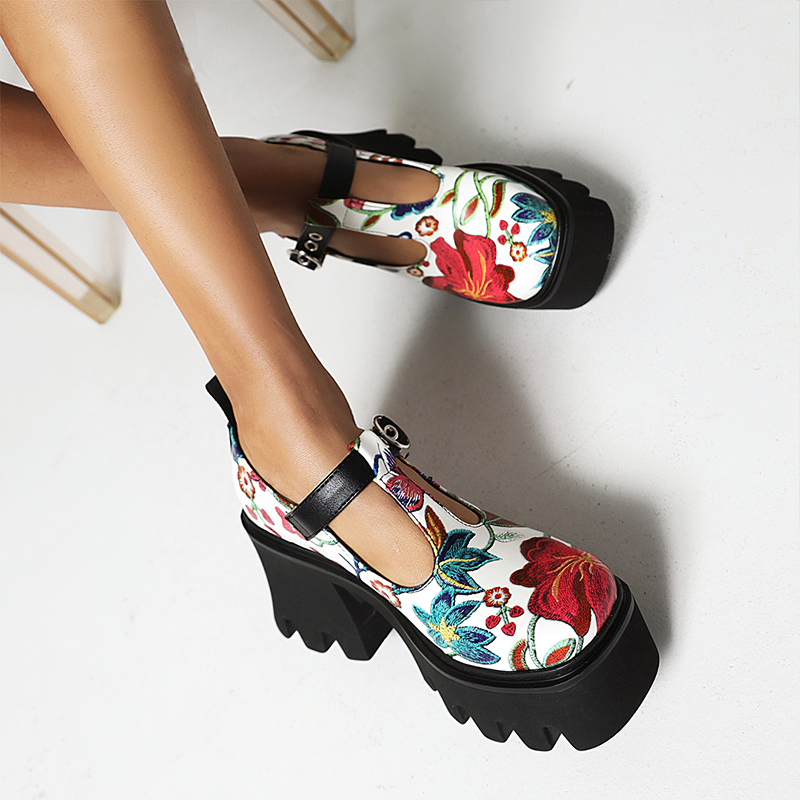 Stylish women's PU leather pumps with vibrant floral prints and chunky platform heels for trendy footwear.