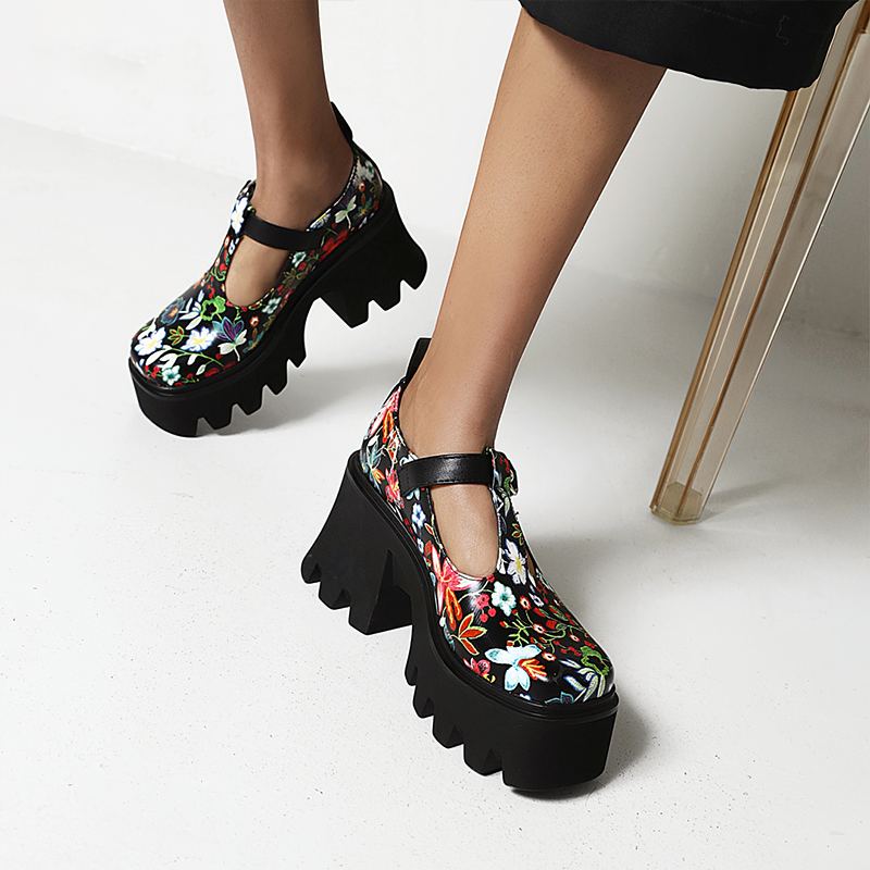 Trendy women's PU leather pumps with vibrant floral prints and chunky platform heels, perfect for stylish outfits.