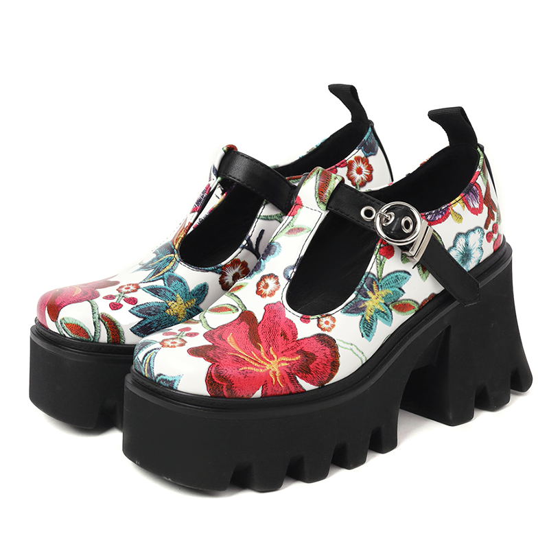 Trendy women's PU leather pumps with vibrant flower print and chunky platform heel, perfect for stylish outfits.