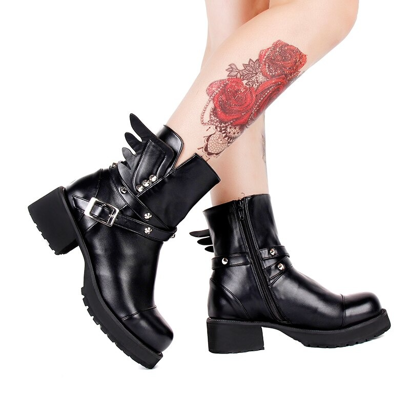 Stylish women's black PU leather rivet boots with buckle strap and wing design, featuring medium square heels.