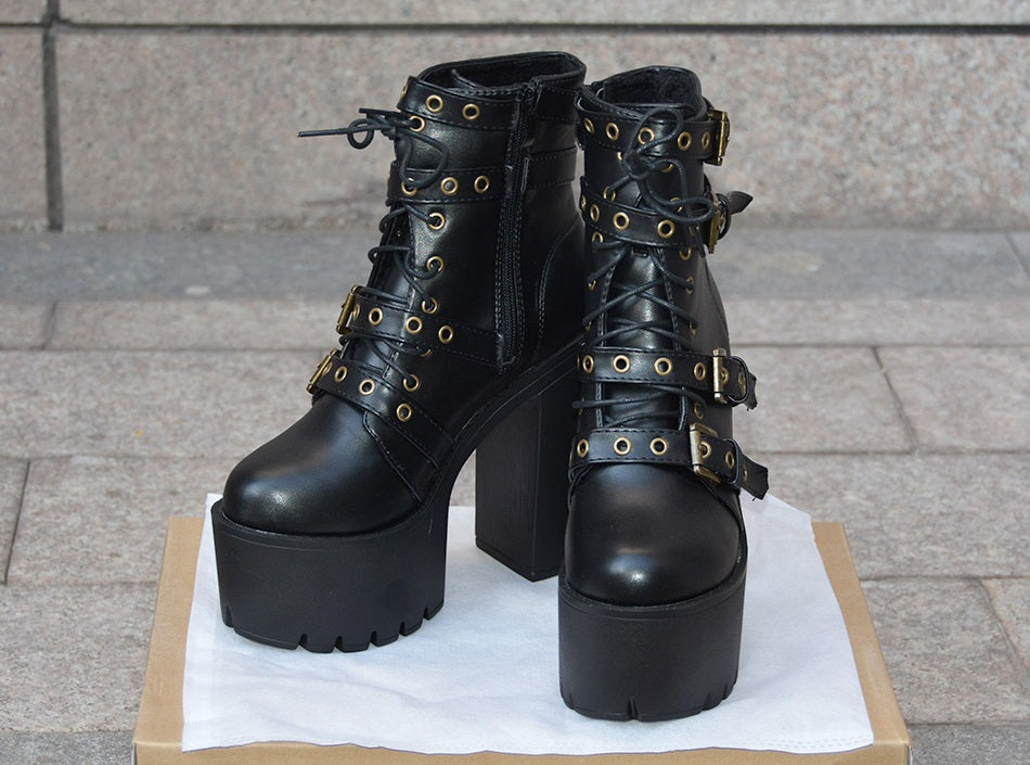 Black Gothic rivet platform boots with thick heels, laces, and buckles, perfect for stylish winter outfits.