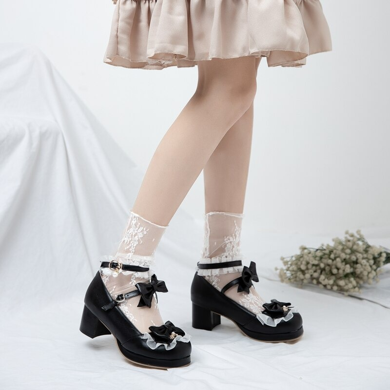 Women's round toe sandals with bow buckle, perfect for cosplay or casual outfits, stylish and comfortable. Black with lace socks.