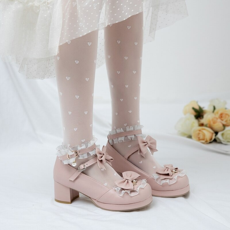 Cute pink round toe sandals with bows, frills, and heart-patterned tights, perfect for cosplay or a charming outfit.