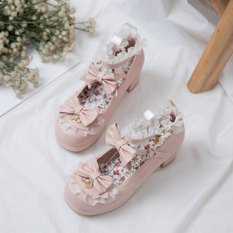 Women's round toe sandals with bow buckles and frilly details, perfect for cosplay and Mary Jane looks.