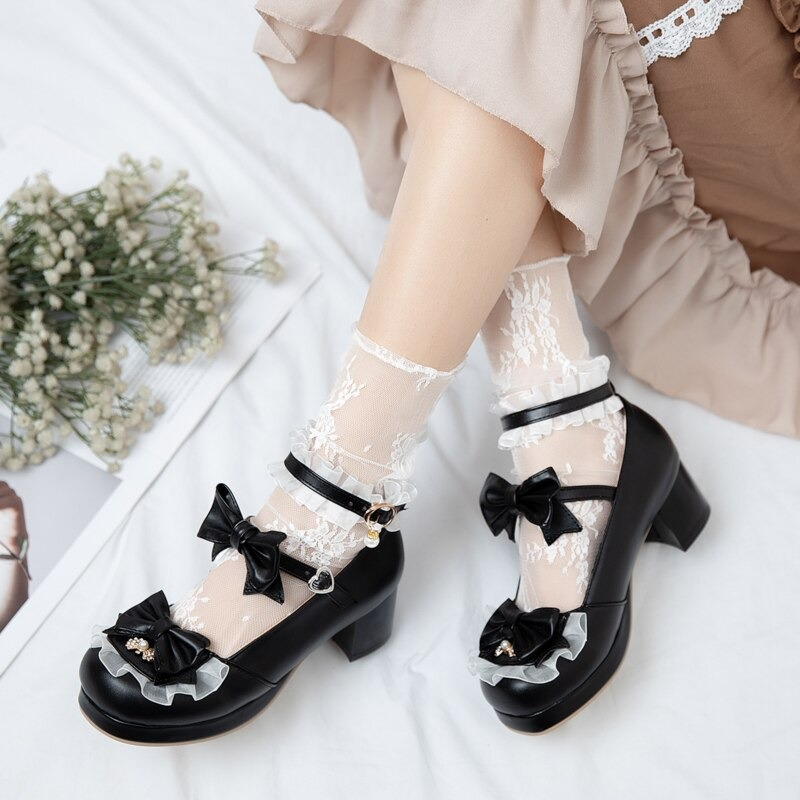 Stylish black Mary Jane shoes with bow buckles, lace socks, and ruffled details, perfect for cosplay and chic outfits.