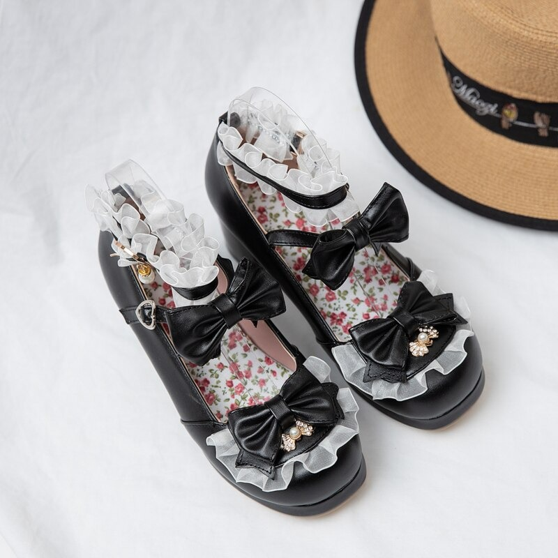 Cute black round toe Mary Jane sandals with bow buckle and ruffled details, perfect for cosplay and stylish outings.