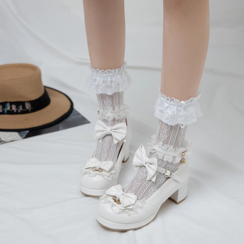 White round toe sandals with bow buckle and lace socks for a cute Mary Jane style.