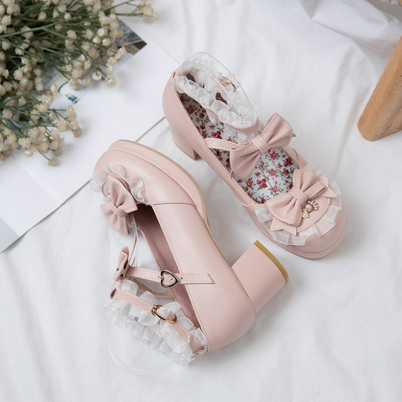 Cute women's round toe sandals with bow buckle, perfect for cosplay or casual outfits, featuring floral details and a small heel.