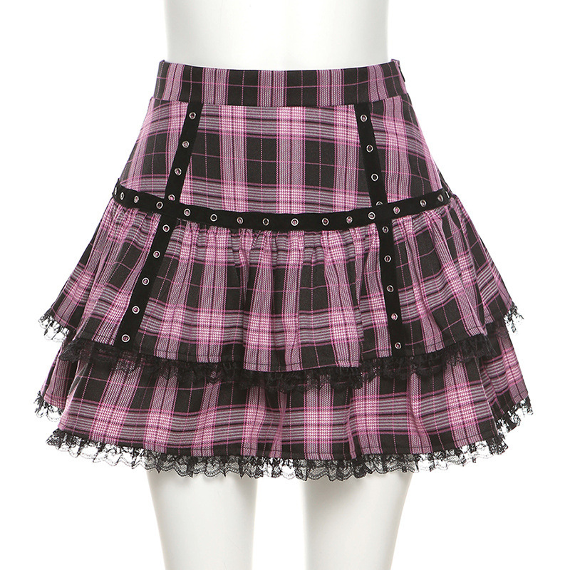 Women's pink and black plaid mini A-line skirt with ruffles, perfect for gothic and alternative fashion styles.