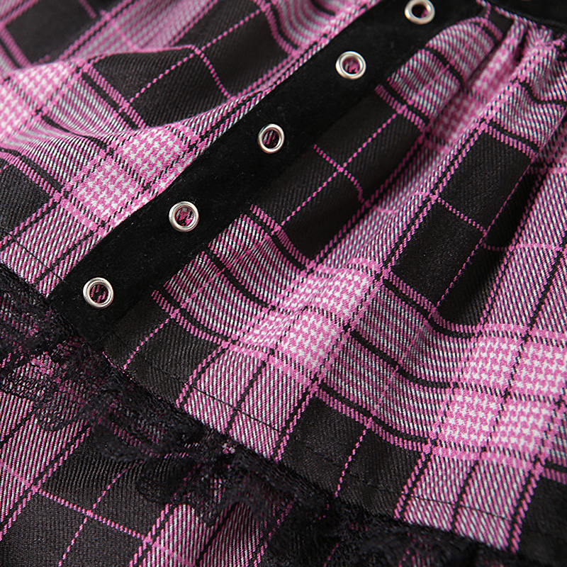 Close-up of women's high waist plaid mini skirt showing black and pink design, buttons, and lace trim.