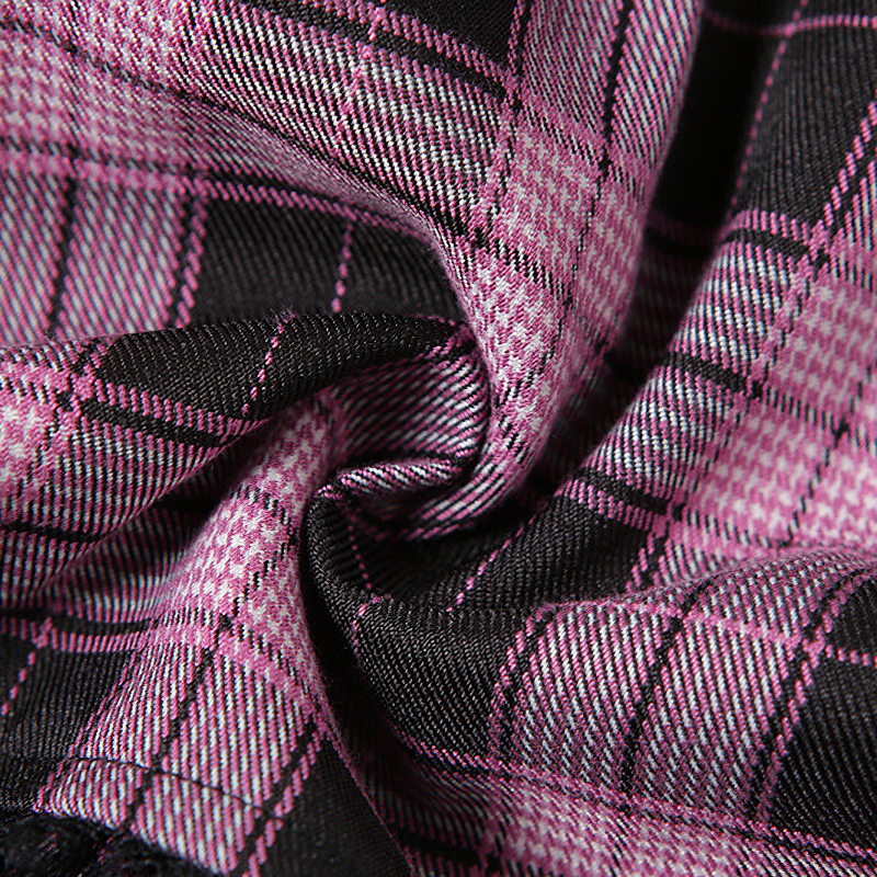 Detail of black and pink plaid fabric showcasing texture for women's gothic style denim skirt.