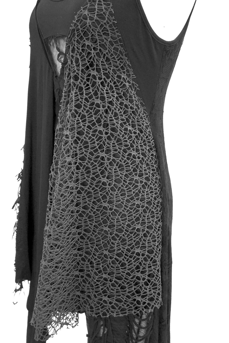 Close-up of a women's black edgy asymmetric dress featuring lace detailing and stylish ripped accents.