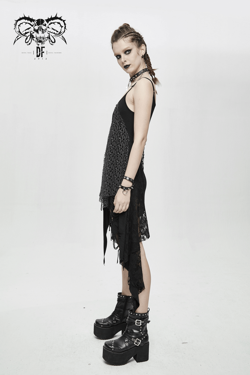 Model showcasing a women's black gothic asymmetric dress with ripped details and stylish boots.