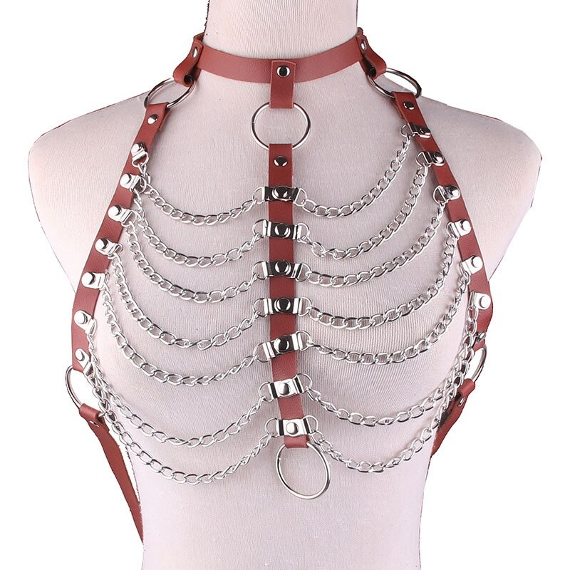 Women's sexy hollow out PU leather body harness with chains and metal rings for alternative fashion.