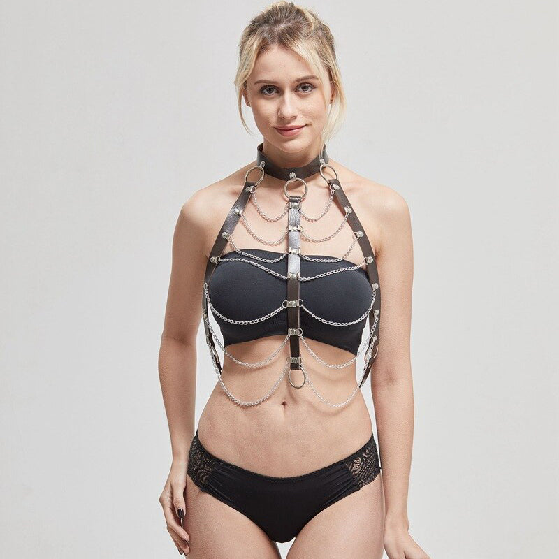 Chic woman wearing a sexy hollow out PU strap necklace harness with chains, perfect for alternative fashion and dance performances.