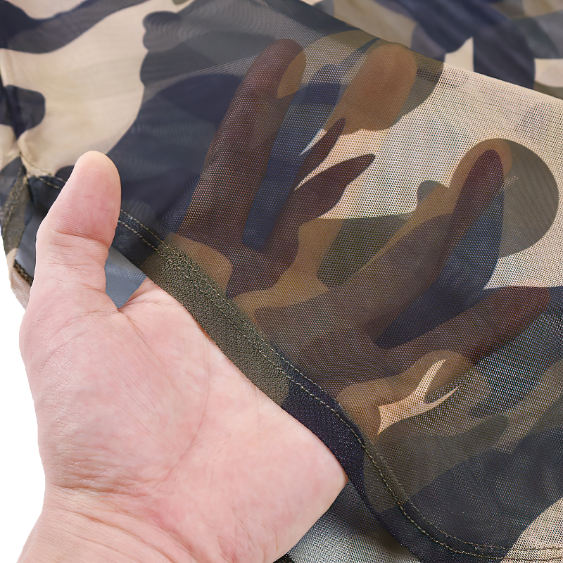 Close-up of the soft camouflage fabric of a women's sexy dress, showcasing its lightweight and stylish design.