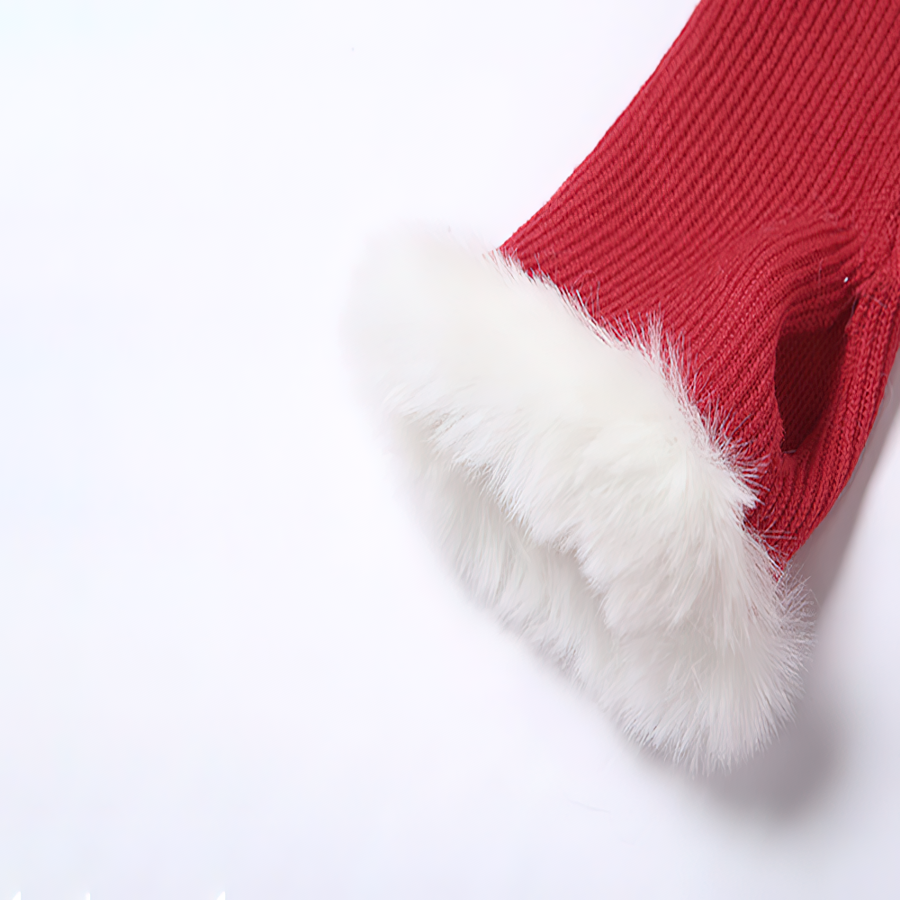 Close-up of red Christmas dress sleeve with fluffy white fur trim, perfect for festive occasions.
