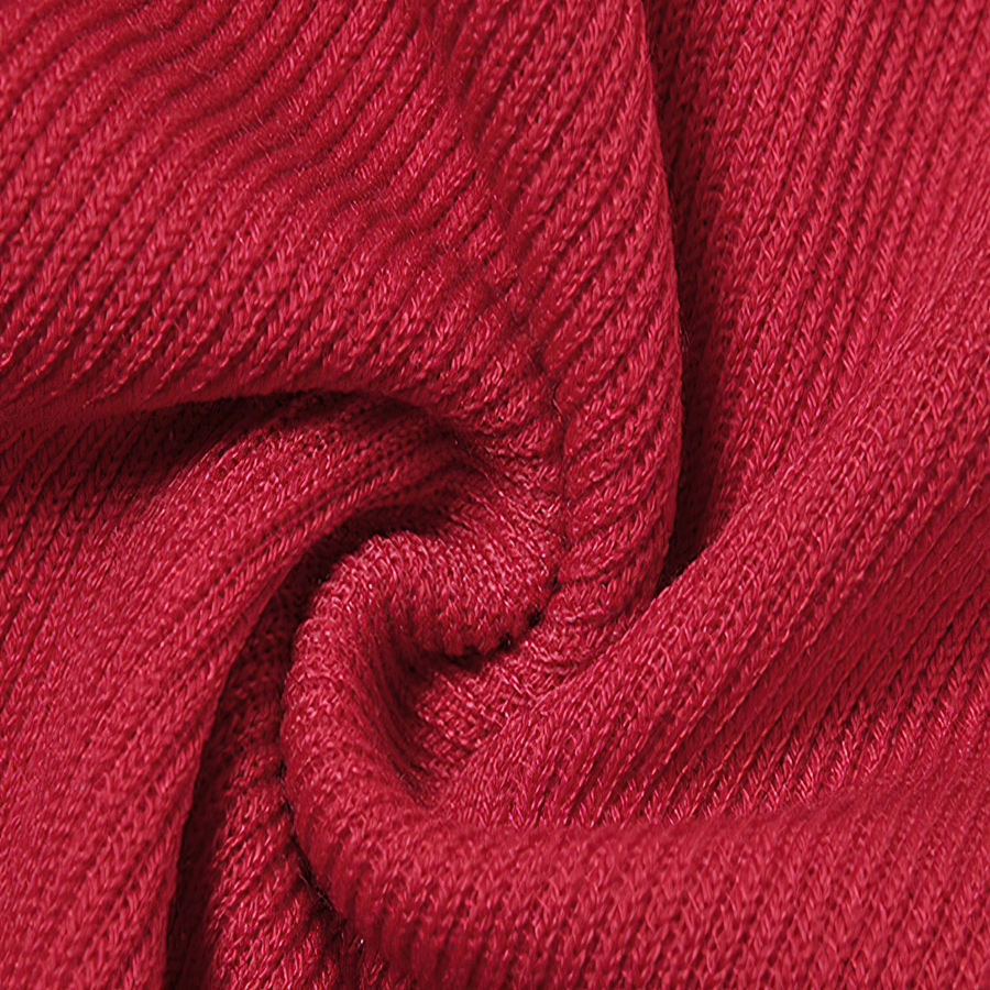 Close-up of soft red fabric with a ribbed texture, perfect for a stylish Christmas dress.