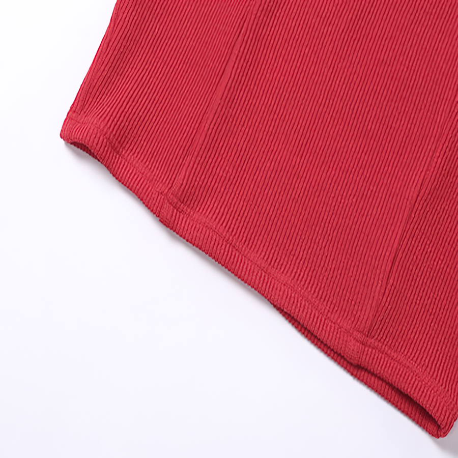 Close-up of the hem of a vibrant red ribbed fabric, perfect for a women's sexy short dress.