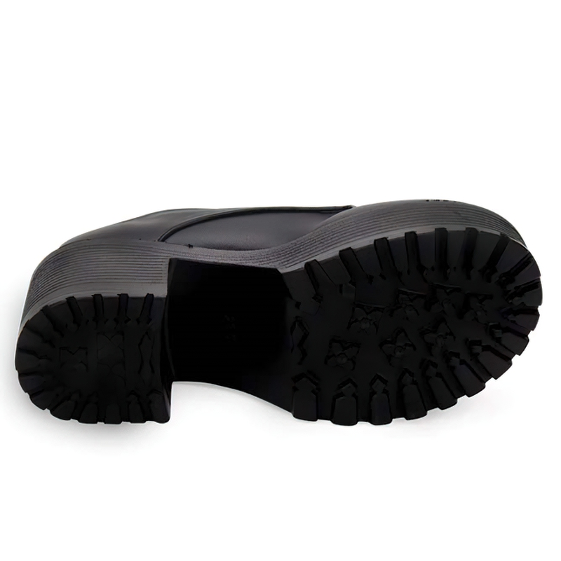 Bottom view of women's thick platform shoes with a rugged sole, showcasing their stylish design and grip.
