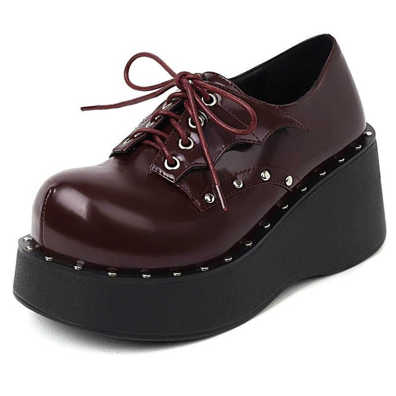 Trendy women's punk platform shoes in dark burgundy with lace-up design and studded detailing.