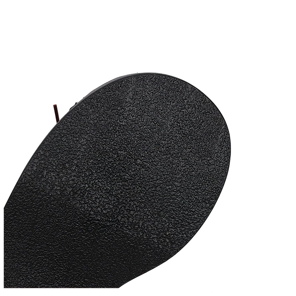 Sole of women's punk-style platform shoes, featuring textured black material for added grip and durability.
