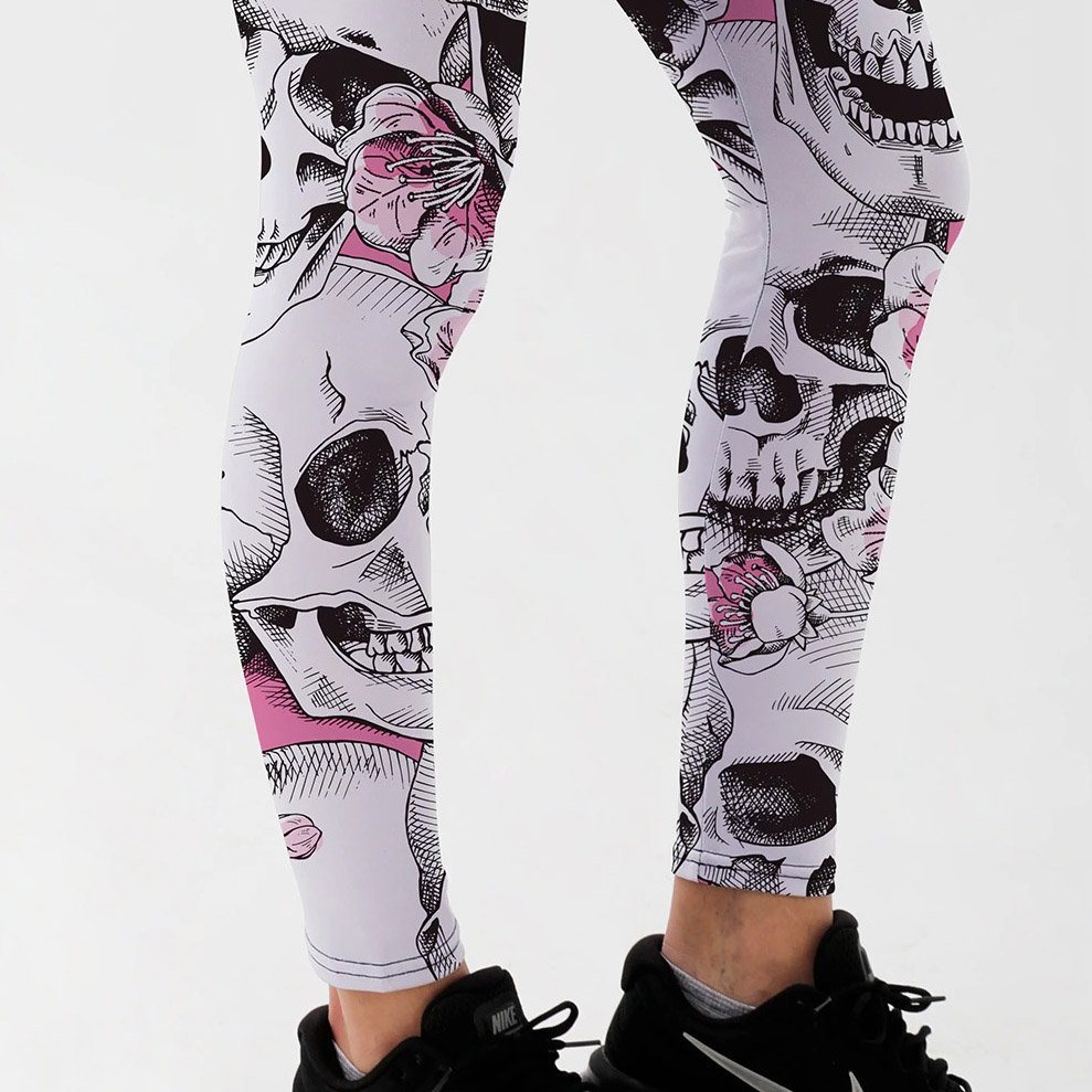 Gothic style women's leggings featuring skull head print and floral accents, perfect for Halloween or casual wear.