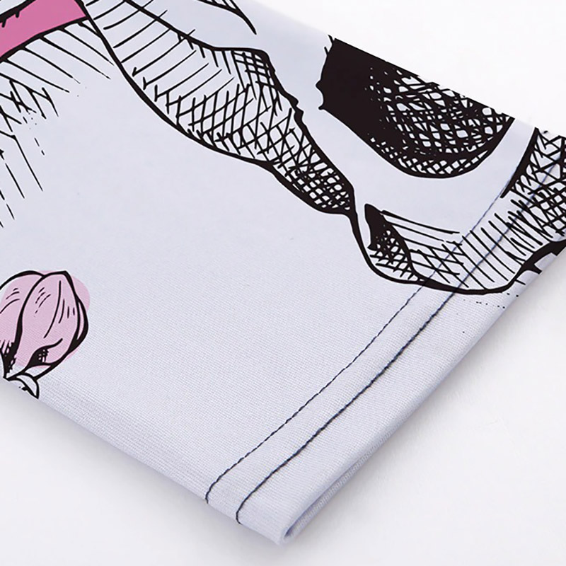 Close-up of Women's Skull Head Print Leggings fabric showcasing Gothic style design and colorful accents.