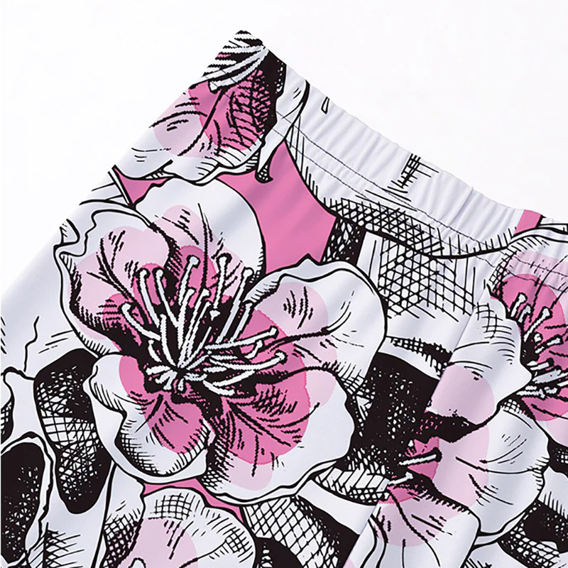 Close-up of Women's leggings featuring bold pink and black floral print, perfect for a stylish and comfortable look.