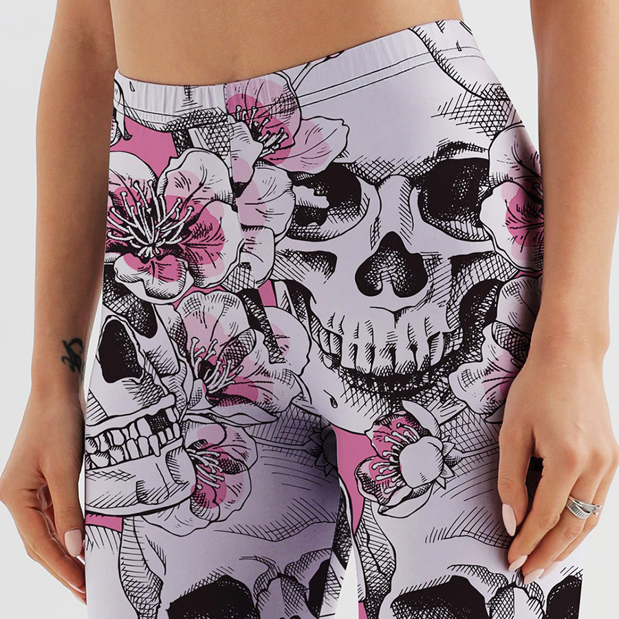Gothic style women's skull print leggings with floral design for a mystical look, perfect for Halloween or everyday wear.