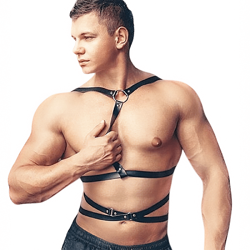 Stylish male model showcasing a sexy body harness with metal O rings, crafted from quality faux leather.