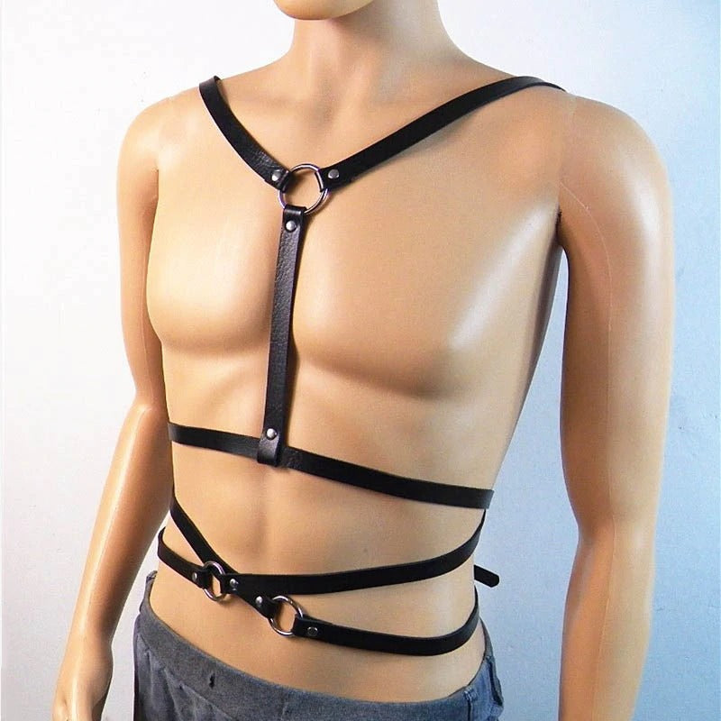 Stylish men's body harness with metal O rings, crafted from faux leather, featuring adjustable straps and a buckle.