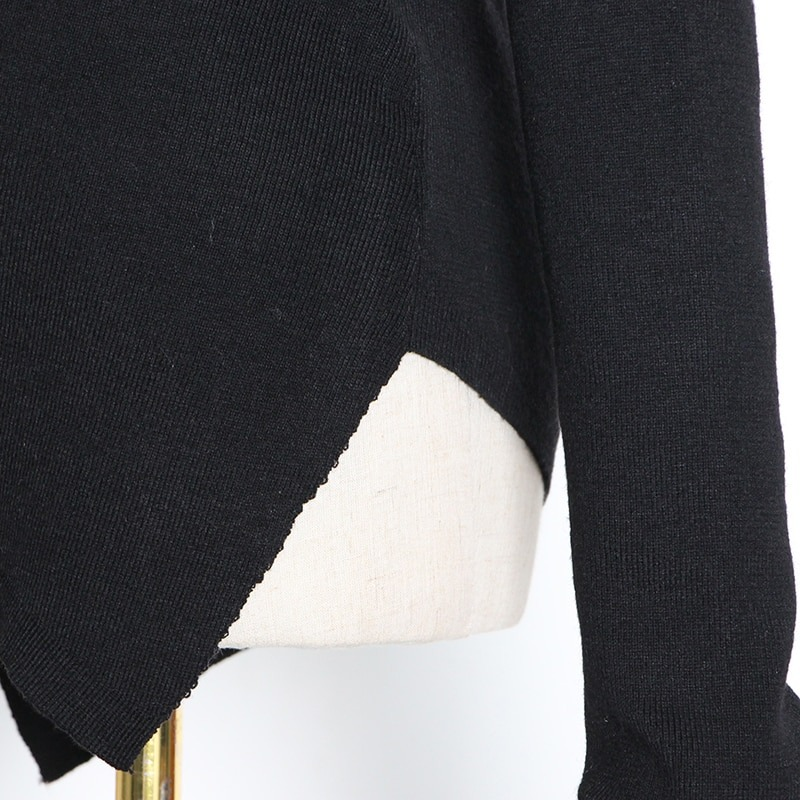 Close-up of black women's slim top showcasing off-shoulder design and stylish hollow-out details for alternative fashion.