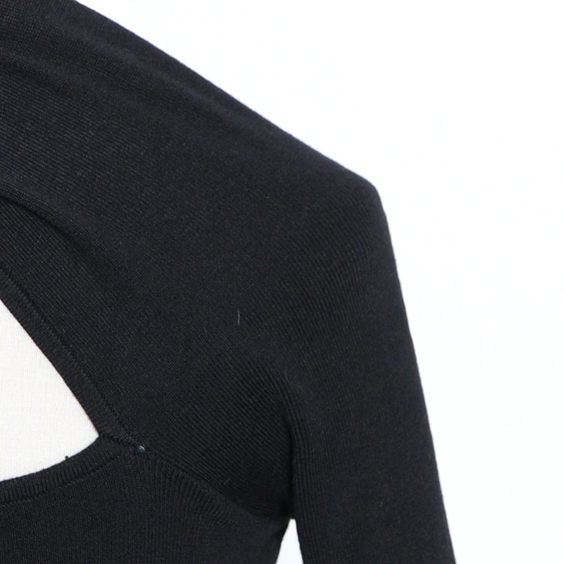 Close-up of black women's slim top with off-shoulder detail, perfect for alternative fashion style.