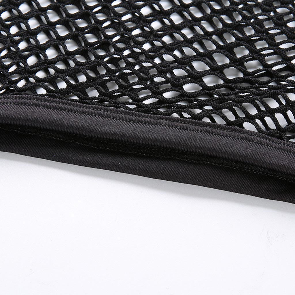 Close-up of a black knitted mesh fabric showcasing intricate detailing and sturdy hem for a gothic crop top.