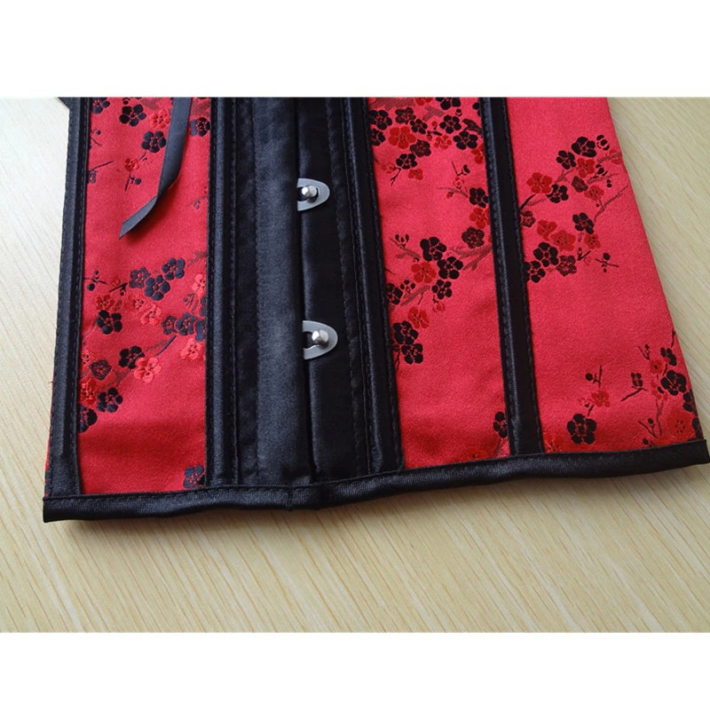 Elegant red gothic corset with floral print, featuring a stylish lace-up design and hooks.