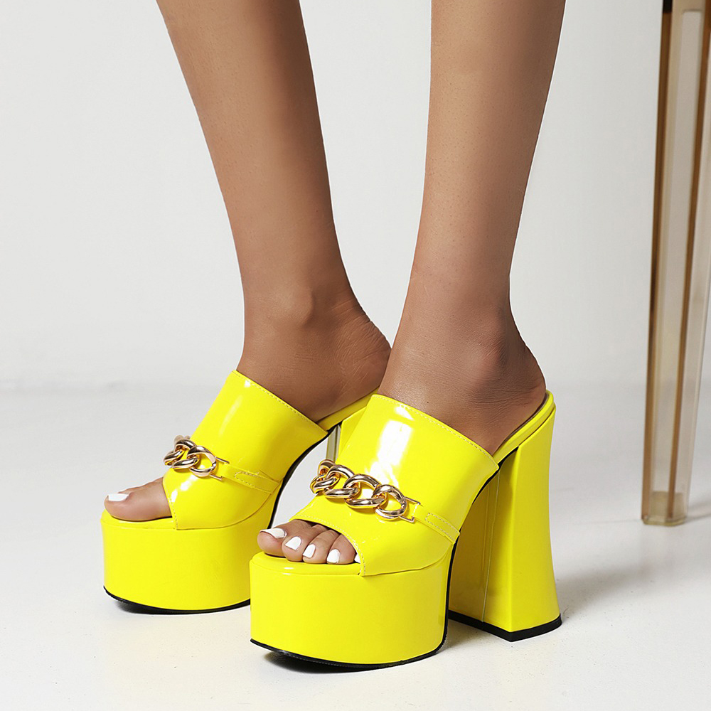 Trendy yellow patent leather peep-toe high heel slippers with chain detail, perfect for summer parties.