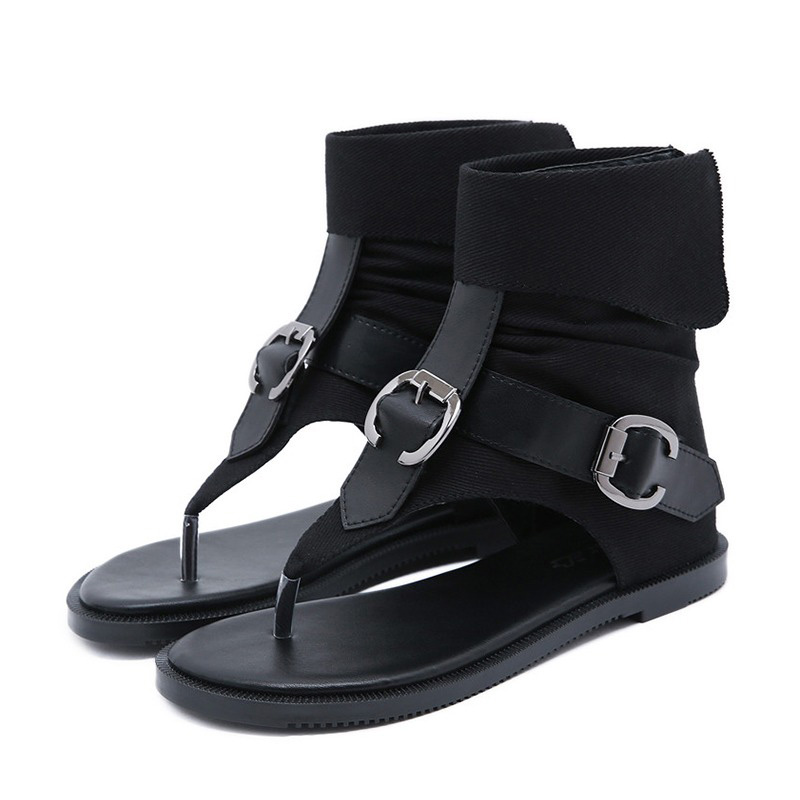 Stylish women's rock-style gladiator flip flops with open toe and ankle straps, perfect for summer outfits.