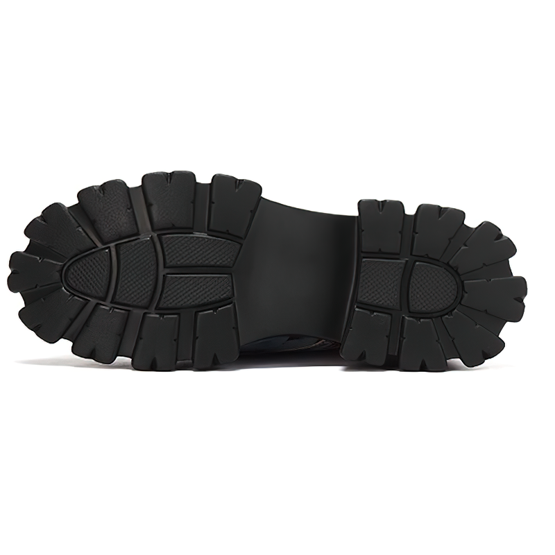 Sole of women's super high heel platform boots featuring a durable tread pattern for optimal traction.